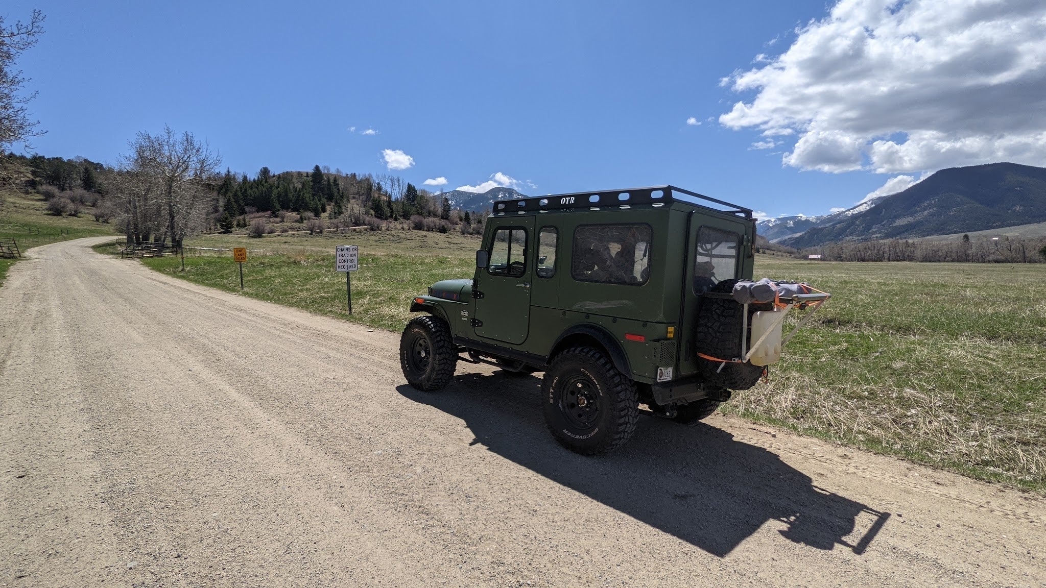 Torque King Roxor on a Montana dirt road with mountains