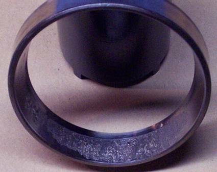 Worn rear axle bearing from Dana 60 axle — failure analysis